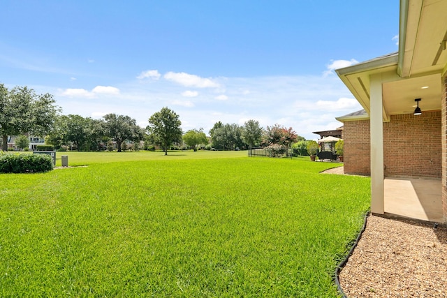 4946 Westchester Dr, Fulshear, TX 77441 - view of grassy yard featuring a patio area