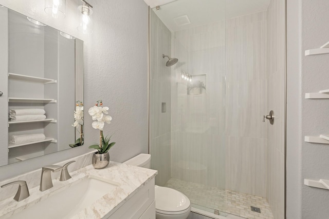 4946 Westchester Dr, Fulshear, TX 77441 - bathroom featuring tiled shower, vanity, and a textured wall