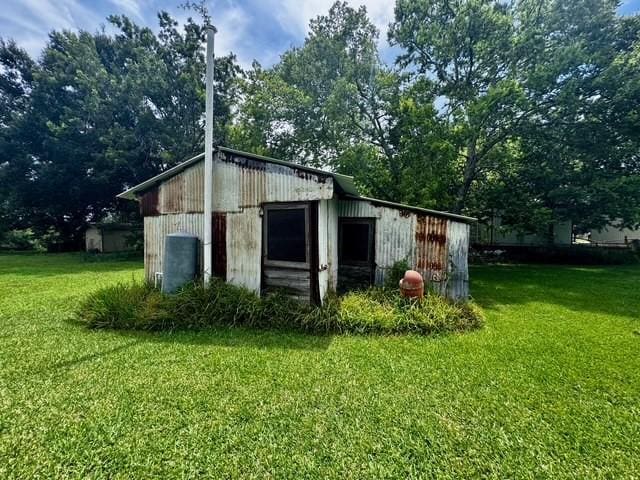 2803 Horn Rd, Bay City, TX 77414 - view of outbuilding with view of wooded area