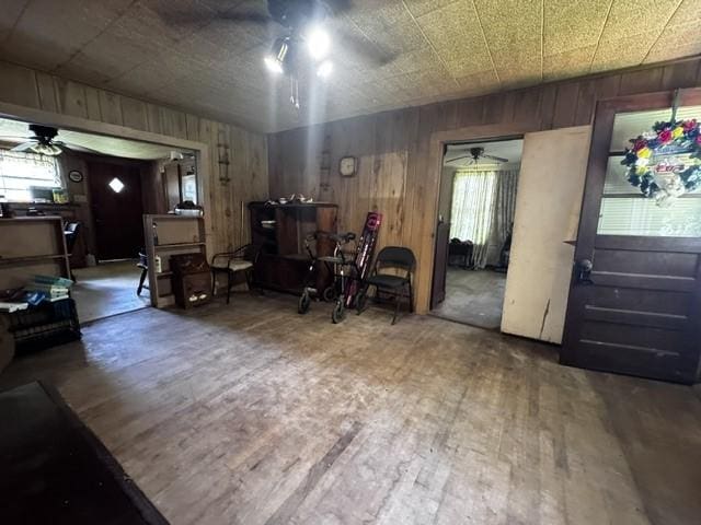 2803 Horn Rd, Bay City, TX 77414 - living area with ceiling fan, wood walls, and wood finished floors
