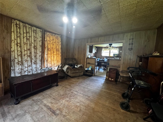 2803 Horn Rd, Bay City, TX 77414 - living room with wood walls and a ceiling fan