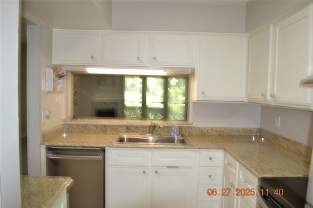 5100 Milwee St Unit 142, Houston, TX 77092 - kitchen featuring stainless steel dishwasher, range, white cabinetry, and light stone countertops