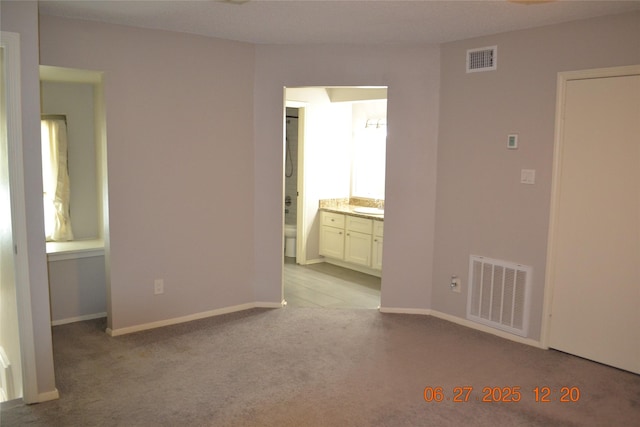5100 Milwee St Unit 142, Houston, TX 77092 - carpeted spare room featuring a sink and baseboards