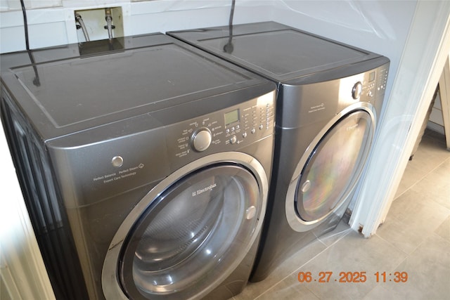 5100 Milwee St Unit 142, Houston, TX 77092 - washroom featuring washer and dryer and tile patterned floors