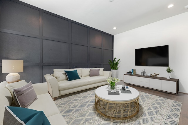 6033 Cypress St, Houston, TX 77074 - living area with a decorative wall, recessed lighting, and wood finished floors