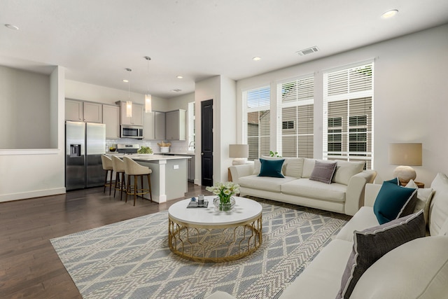 6033 Cypress St, Houston, TX 77074 - living area featuring dark wood-style floors and recessed lighting