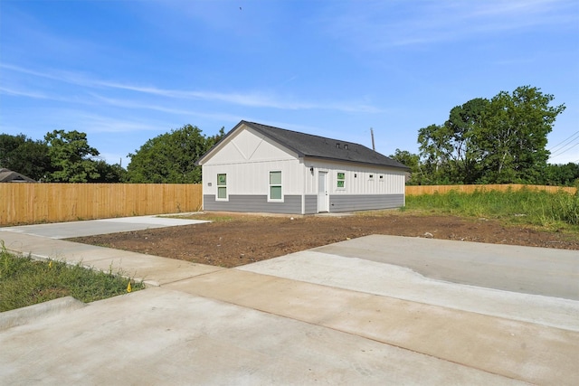 1026 Theresa St, Houston, TX 77051 - view of home's exterior featuring a patio and board and batten siding