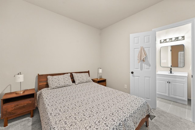 1026 Theresa St, Houston, TX 77051 - bedroom featuring light carpet, ensuite bathroom, and lofted ceiling