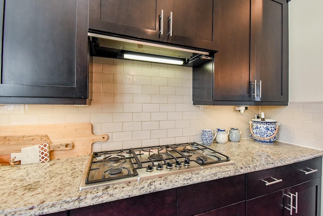 2230 Lakeshore Edge Dr, Houston, TX 77080 - kitchen with extractor fan, stainless steel gas stovetop, backsplash, and dark brown cabinetry