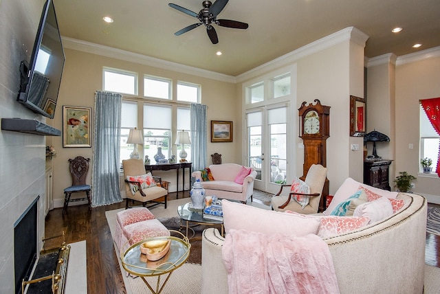2230 Lakeshore Edge Dr, Houston, TX 77080 - living room featuring a ceiling fan, healthy amount of natural light, crown molding, wood finished floors, and a fireplace with flush hearth