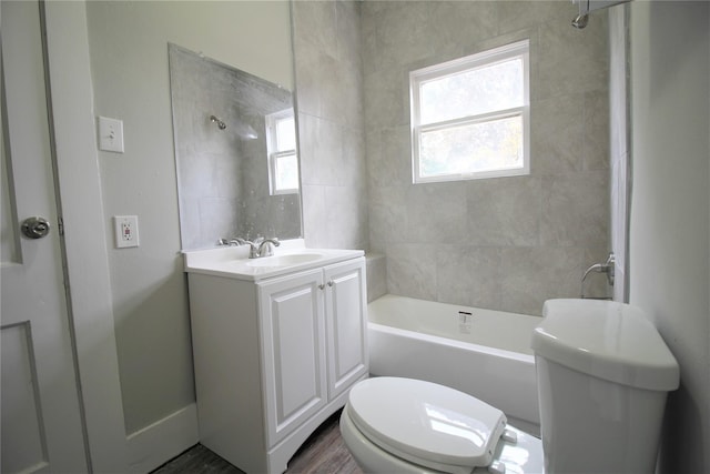 716 Olive St, Wharton, TX 77488 - bathroom with vanity, shower / tub combination, and wood finished floors