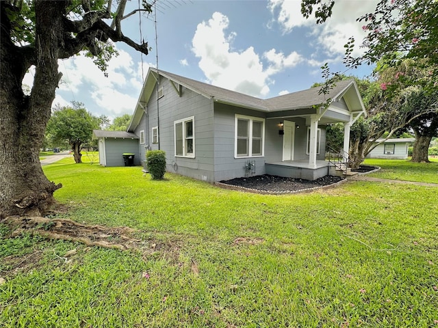 716 Olive St, Wharton, TX 77488 - view of home's exterior with a porch and a lawn