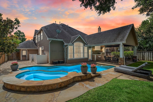 3423 Velasco Ct, Missouri City, TX 77459 - pool at dusk with a patio area