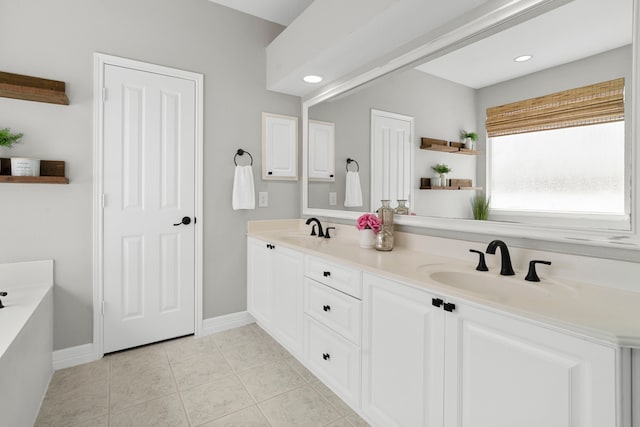 3423 Velasco Ct, Missouri City, TX 77459 - bathroom with double vanity, a garden tub, tile patterned flooring, and recessed lighting
