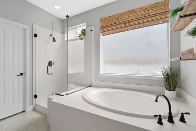 3423 Velasco Ct, Missouri City, TX 77459 - bathroom featuring a shower stall, a garden tub, tile patterned flooring, and recessed lighting