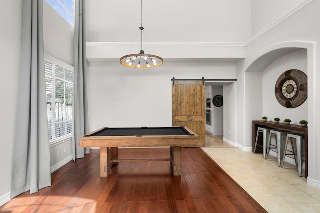 3423 Velasco Ct, Missouri City, TX 77459 - rec room with a barn door, a high ceiling, a chandelier, wood finished floors, and pool table
