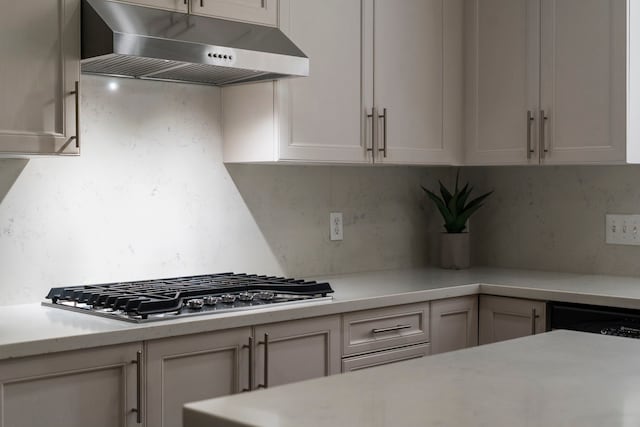 3423 Velasco Ct, Missouri City, TX 77459 - kitchen featuring extractor fan, stainless steel gas stovetop, light countertops, and backsplash