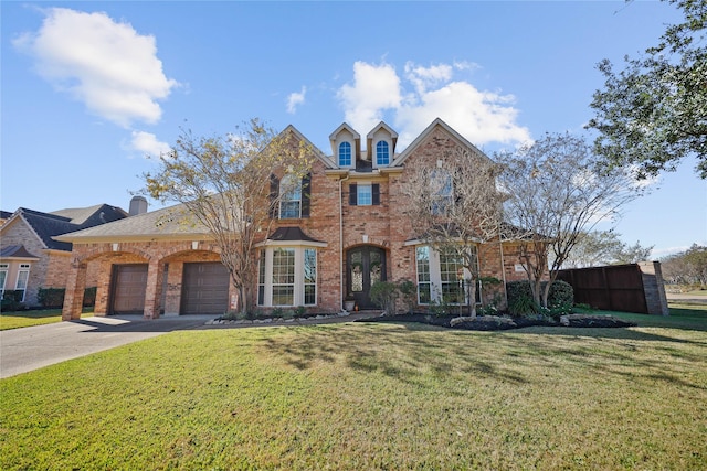 18815 Manleigh Ct, Tomball, TX 77377 - traditional home featuring brick siding, concrete driveway, and a garage