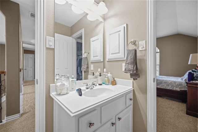 18815 Manleigh Ct, Tomball, TX 77377 - bathroom featuring vanity, vaulted ceiling, and connected bathroom