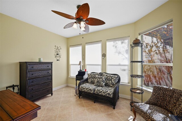 18815 Manleigh Ct, Tomball, TX 77377 - living area with a ceiling fan, healthy amount of natural light, and light tile patterned floors