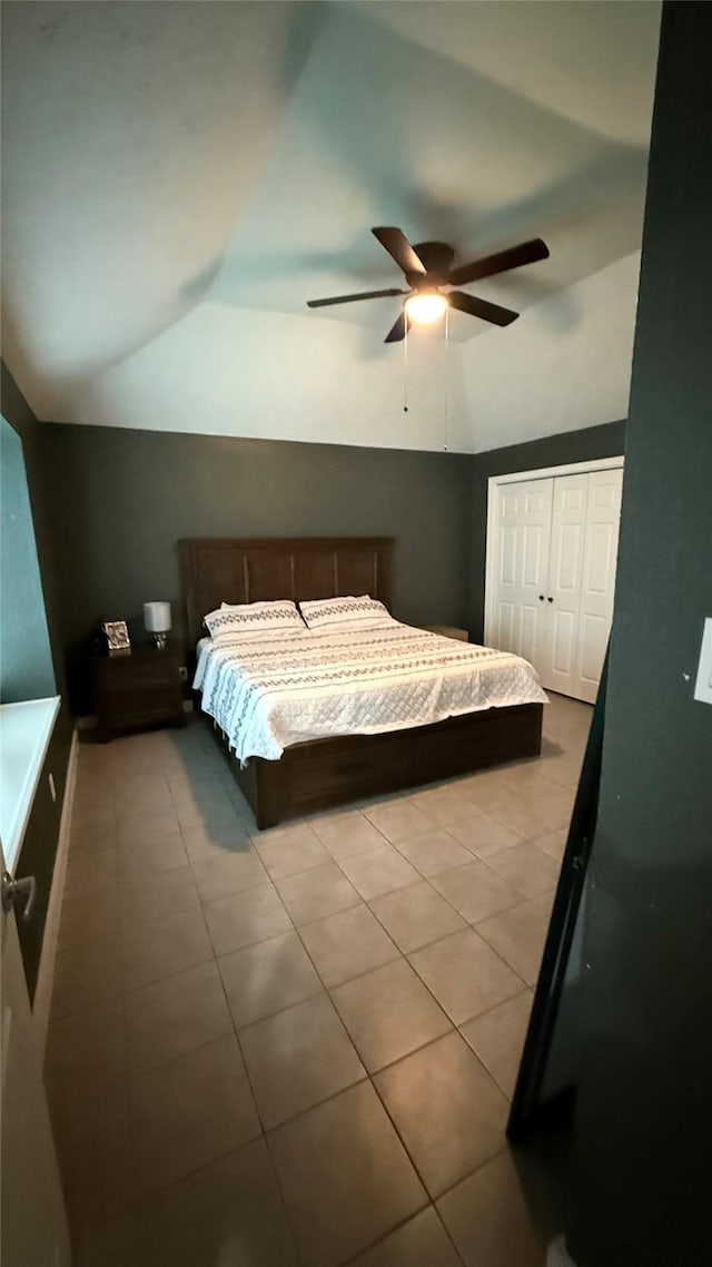 6018 Beaconridge Dr, Houston, TX 77053 - bedroom with vaulted ceiling, tile patterned flooring, a closet, and ceiling fan