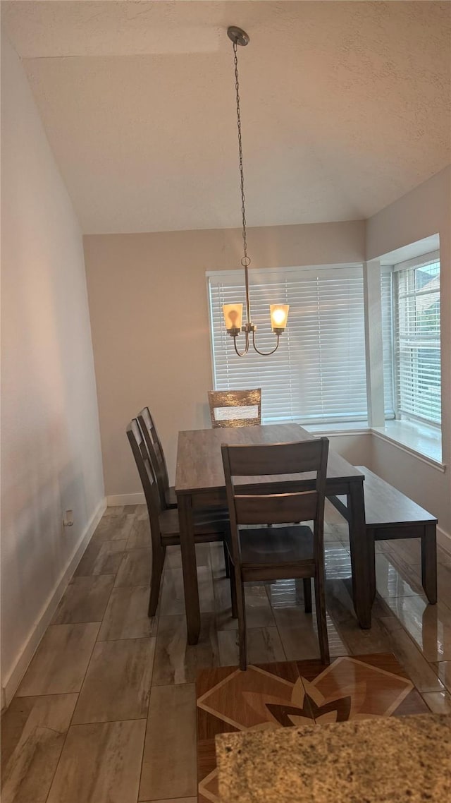 6018 Beaconridge Dr, Houston, TX 77053 - dining area featuring a chandelier and a textured ceiling