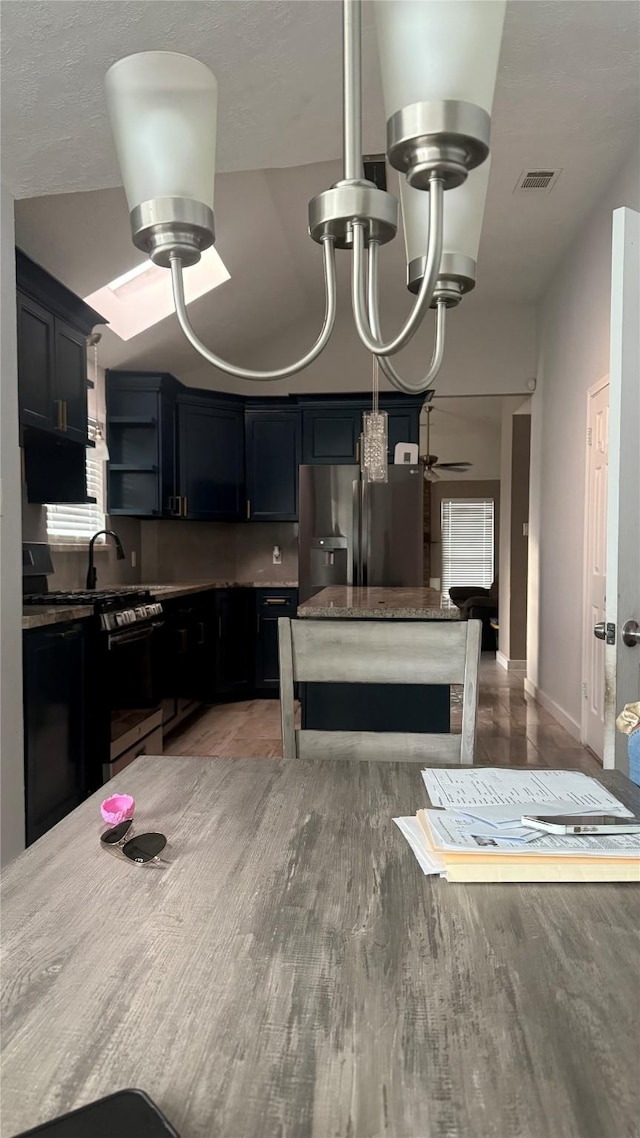 6018 Beaconridge Dr, Houston, TX 77053 - kitchen featuring stainless steel appliances, open shelves, a ceiling fan, and a center island