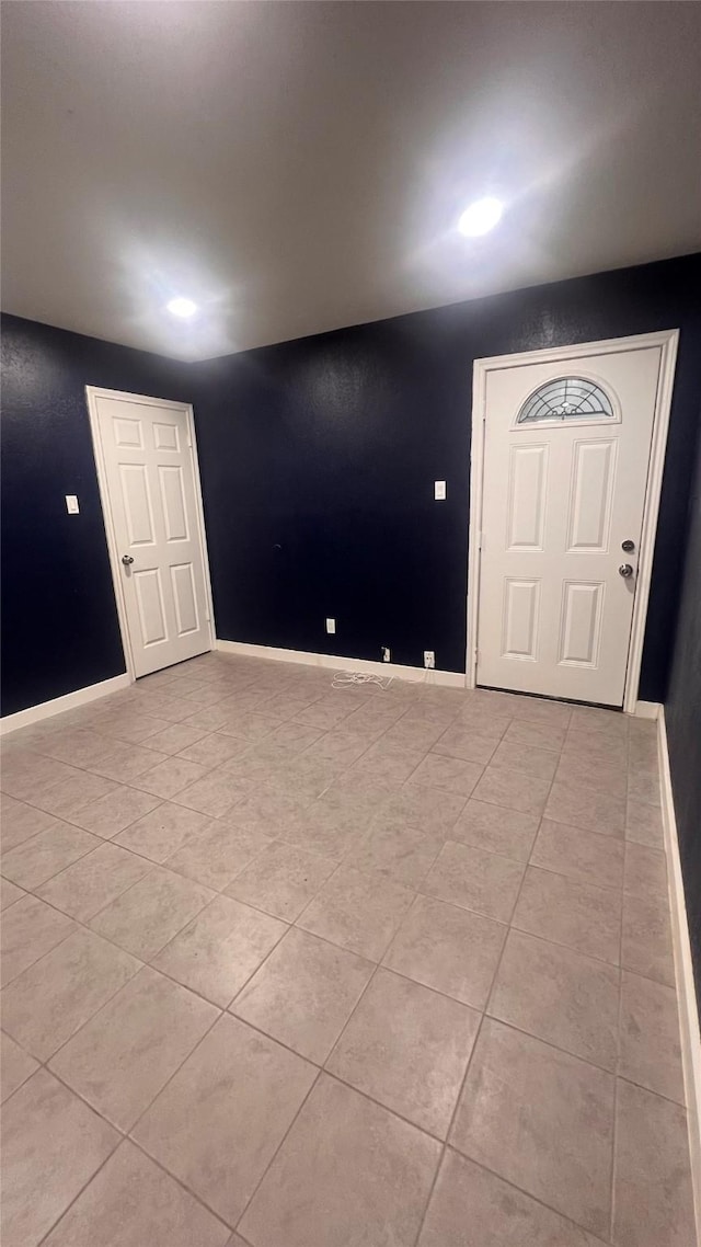 6018 Beaconridge Dr, Houston, TX 77053 - foyer entrance featuring light tile patterned flooring and baseboards