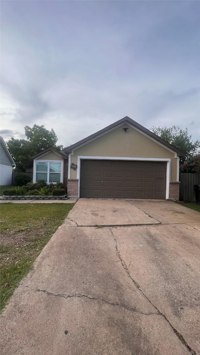 6018 Beaconridge Dr, Houston, TX 77053 - view of front of home with brick siding, concrete driveway, and a garage