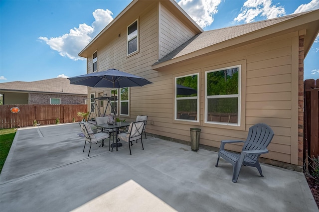 15055 Meadow Gln N, Conroe, TX 77306 - view of patio featuring outdoor dining space