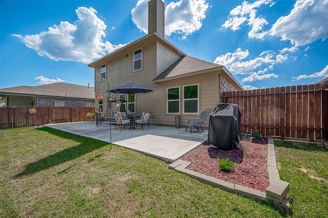 15055 Meadow Gln N, Conroe, TX 77306 - back of house with a fenced backyard, a patio area, and a chimney
