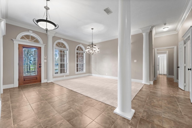 11510 Walden Rd, Montgomery, TX 77356 - foyer with crown molding, decorative columns, a chandelier, and tile patterned flooring