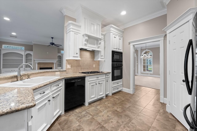 11510 Walden Rd, Montgomery, TX 77356 - kitchen featuring black appliances, ceiling fan, crown molding, recessed lighting, and decorative backsplash