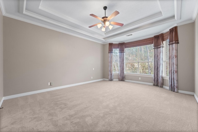11510 Walden Rd, Montgomery, TX 77356 - empty room featuring a raised ceiling, a ceiling fan, light colored carpet, and ornamental molding