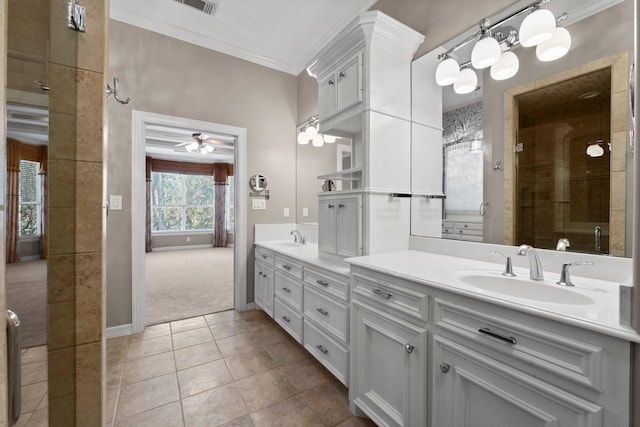11510 Walden Rd, Montgomery, TX 77356 - full bathroom with double vanity, ceiling fan, crown molding, tile patterned floors, and tiled shower