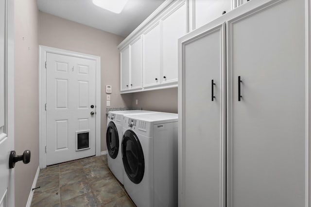 11510 Walden Rd, Montgomery, TX 77356 - laundry area featuring cabinet space, washer and clothes dryer, and stone finish flooring