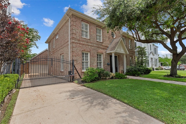 3908 Milton St, West University Place, TX 77005 - view of front facade featuring brick siding, a front lawn, a gate, and concrete driveway