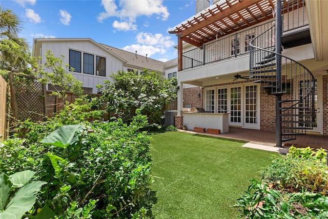 3908 Milton St, West University Place, TX 77005 - fenced backyard featuring ceiling fan, a balcony, a patio, and a pergola
