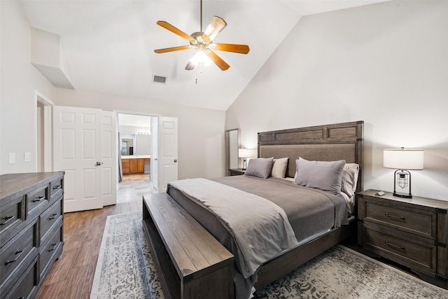 7 Bending Branch Pl, Spring, TX 77381 - bedroom with wood finished floors, high vaulted ceiling, ensuite bathroom, and a ceiling fan