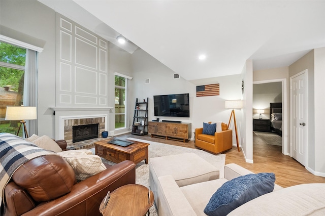 7 Bending Branch Pl, Spring, TX 77381 - living room featuring light wood-style floors, a fireplace, and high vaulted ceiling