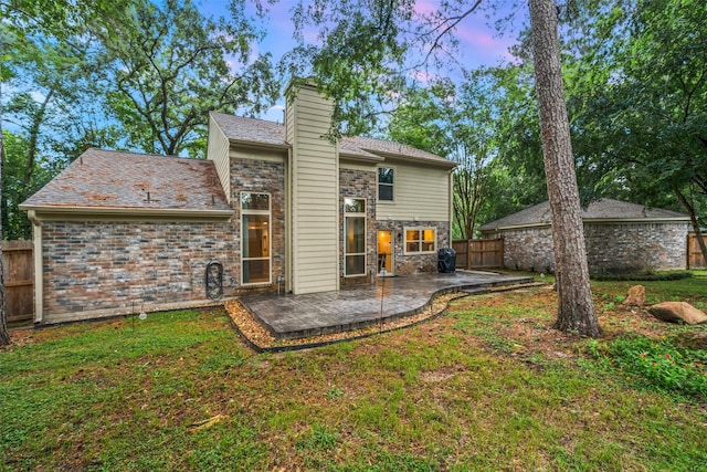 7 Bending Branch Pl, Spring, TX 77381 - rear view of property with a patio area, stone siding, and a chimney