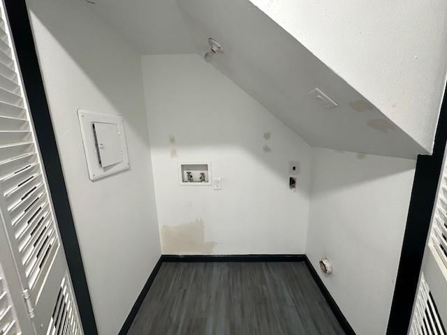 9009 Imogene St Unit E, Houston, TX 77036 - laundry area featuring hookup for a washing machine, electric panel, and wood finished floors