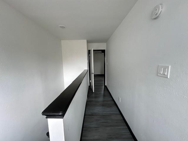 9009 Imogene St Unit E, Houston, TX 77036 - corridor with an upstairs landing and dark wood-type flooring