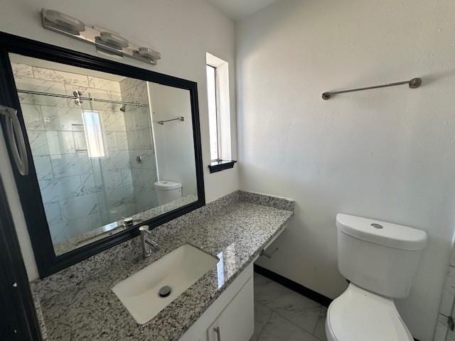 9009 Imogene St Unit E, Houston, TX 77036 - full bath with marble look tile flooring, vanity, plenty of natural light, and a tile shower