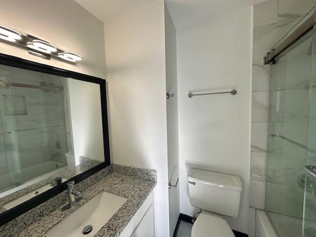 9009 Imogene St Unit E, Houston, TX 77036 - full bath featuring vanity and shower / bath combination with glass door