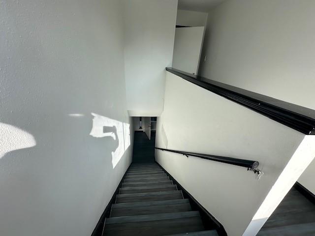 9009 Imogene St Unit E, Houston, TX 77036 - staircase with wood finished floors