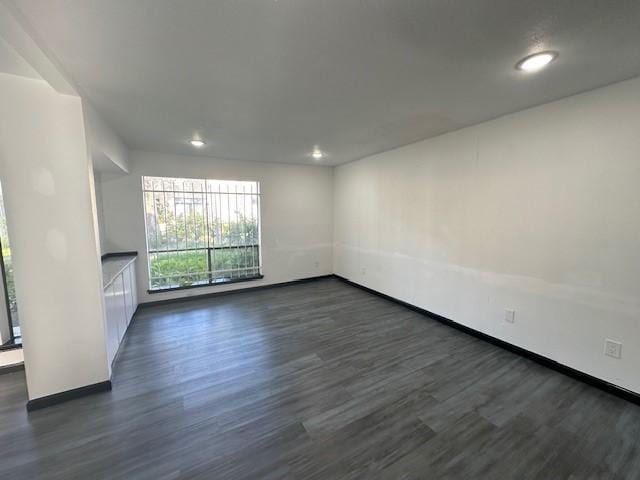 9009 Imogene St Unit E, Houston, TX 77036 - spare room featuring dark wood-style floors and recessed lighting