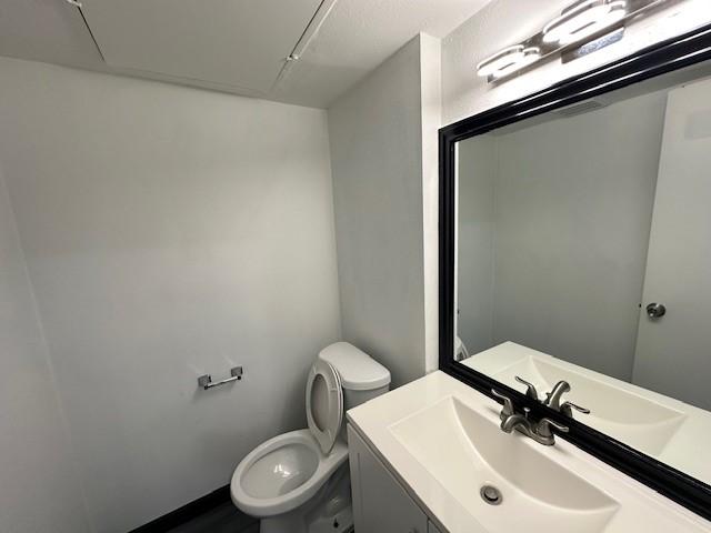 9009 Imogene St Unit E, Houston, TX 77036 - half bathroom featuring toilet and vanity