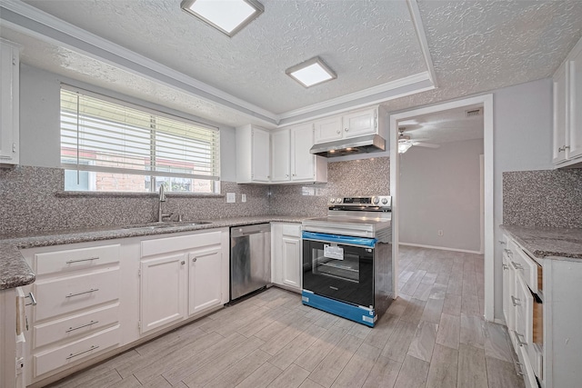 10423 Rancho Bernardo Ln, Sugar Land, TX 77498 - kitchen with stainless steel dishwasher, range with electric cooktop, a textured ceiling, under cabinet range hood, and light wood-type flooring