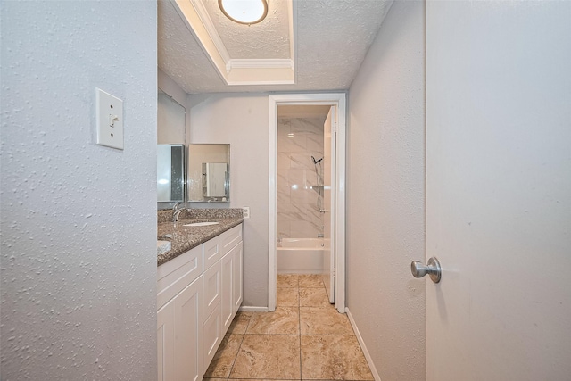10423 Rancho Bernardo Ln, Sugar Land, TX 77498 - bathroom featuring a textured ceiling, double vanity, bathing tub / shower combination, and tile patterned floors